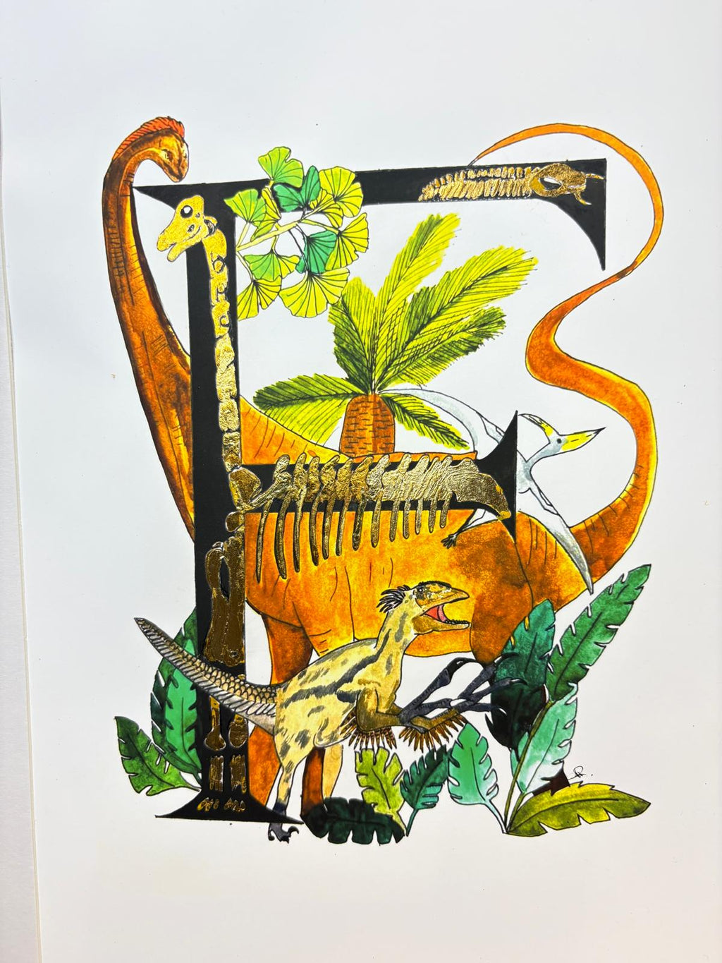 Gilded gold letter F for frightening dinosaurs