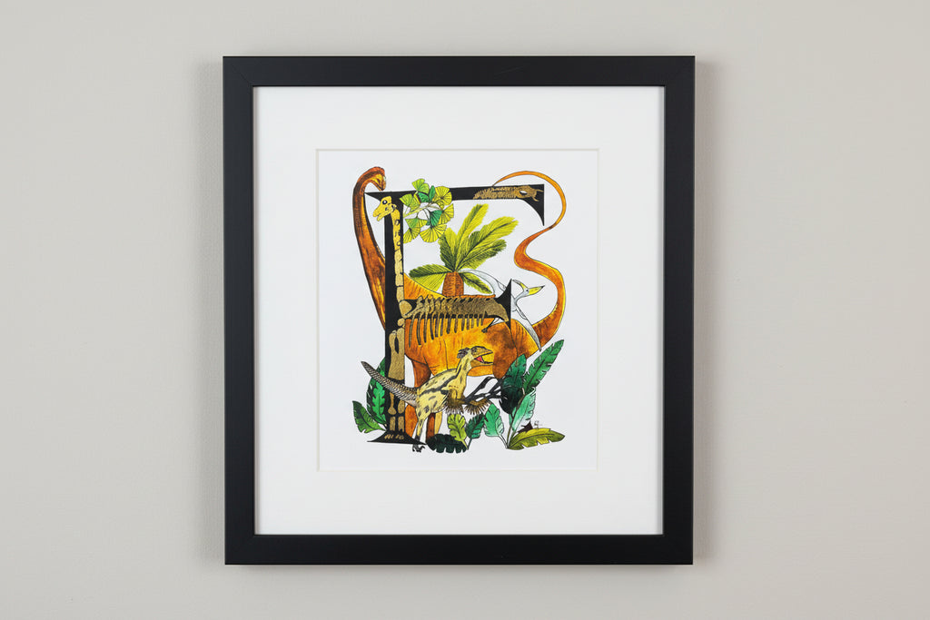 Gilded gold letter F for frightening dinosaurs