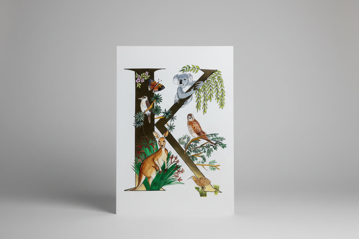 Decorative paper cutout with Australian animals and nature elements on a white background